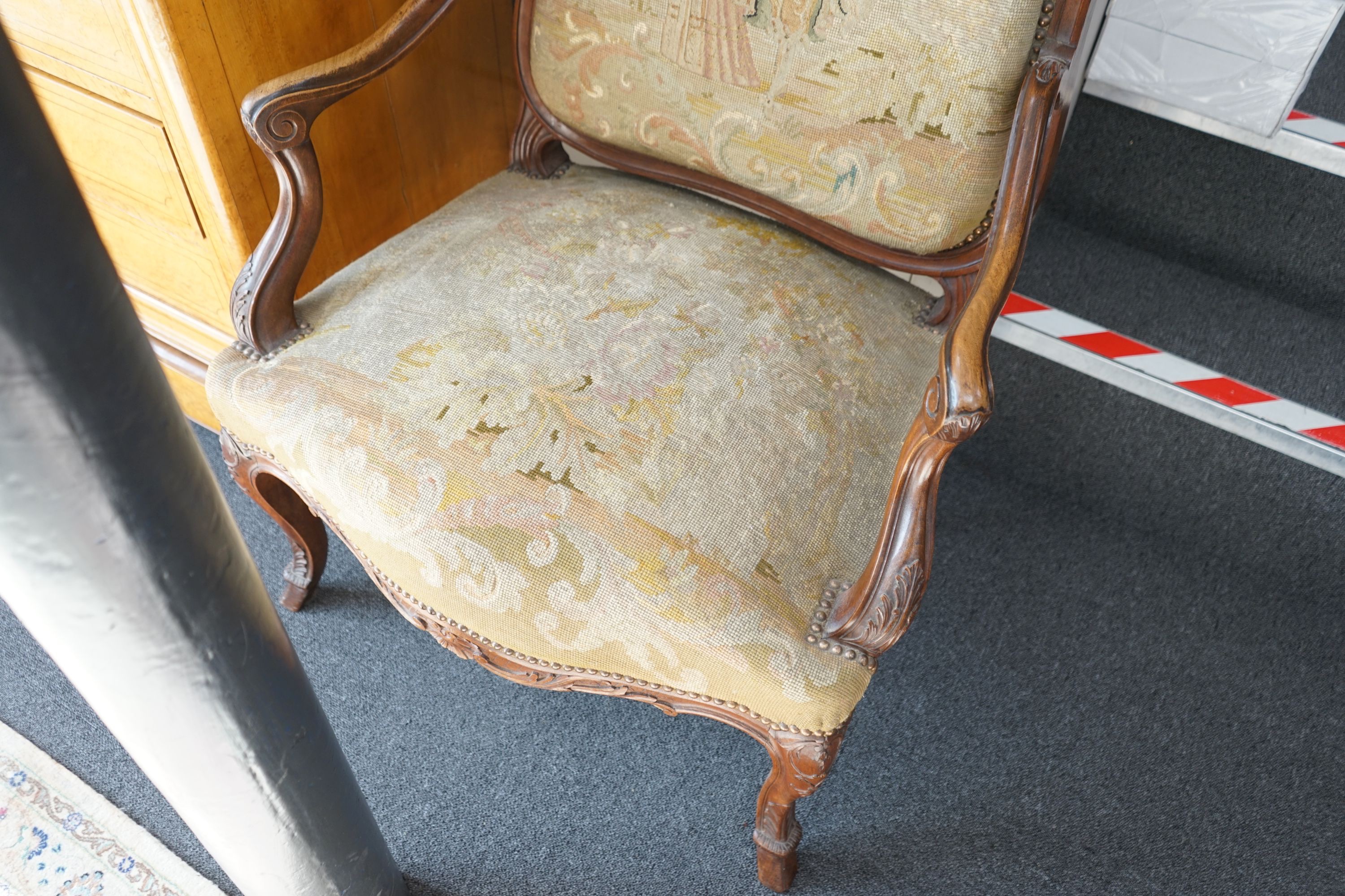 A pair of French carved walnut fauteuils with tapestry upholstery, width 75cm, depth 62cm, height 120cm